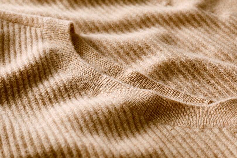 Detail of taupe cashmere sweater