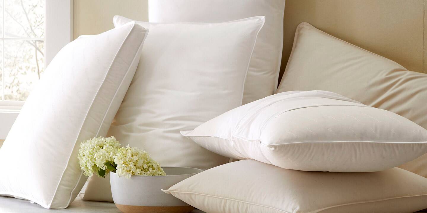 image of collection of down and down-alternative pillows in various fills