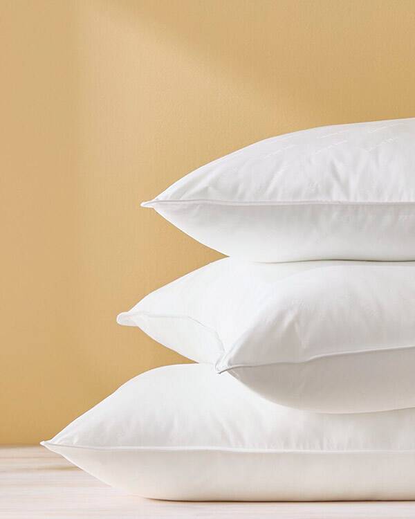 stack of Garnet Hill Signature White Down Pillows